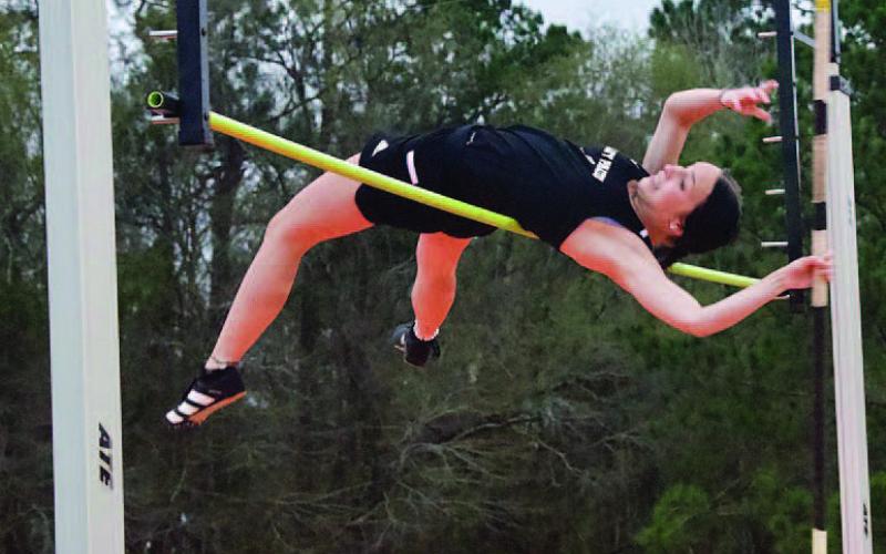 Jana Baters placed second in the girls pole vault by clearing eight feet. Photo by Randall Luker