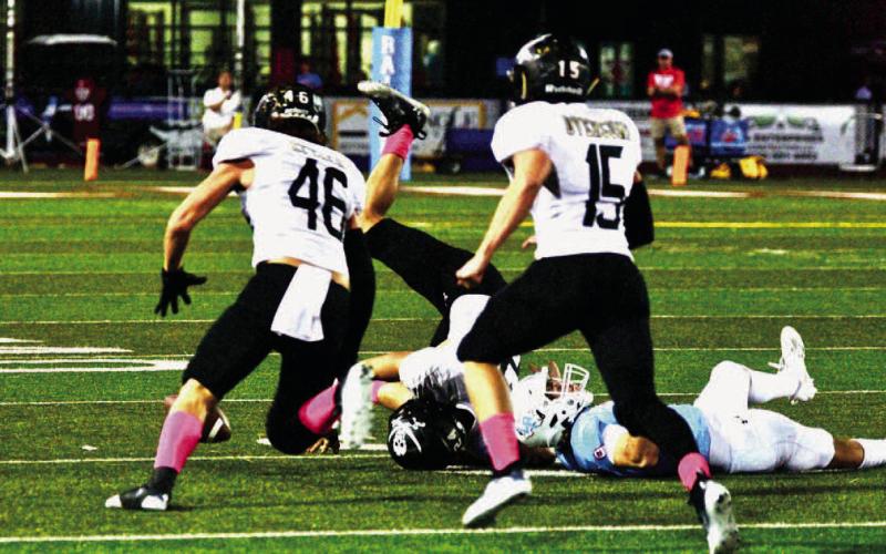 Blayden Laughlin, #46, scored a touchdown on this scoop and score after Jarrett Odom, center, caused the fumble. Josh McCord, #15, is also pictured.
