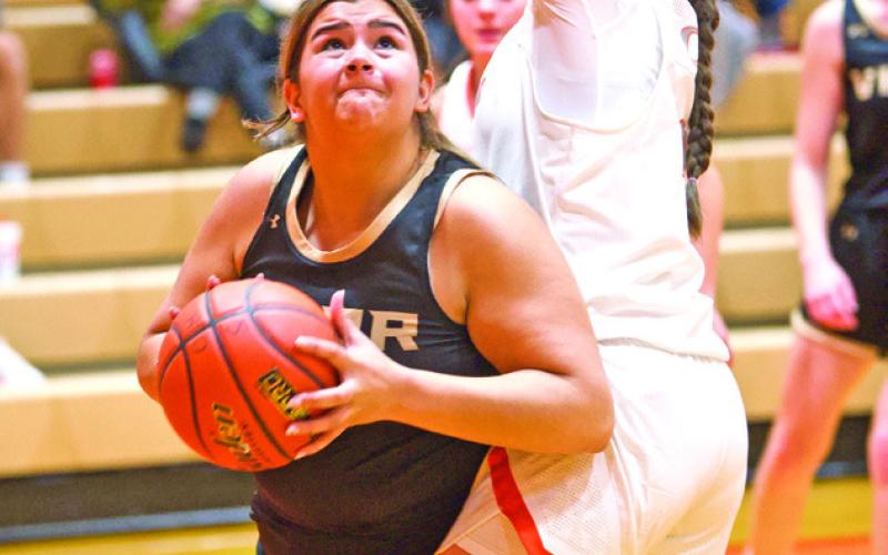 Scoping it out Senior power forward Laiken Brodnax is looking for her shot under the basket as a Lady Bobcat goes for block.