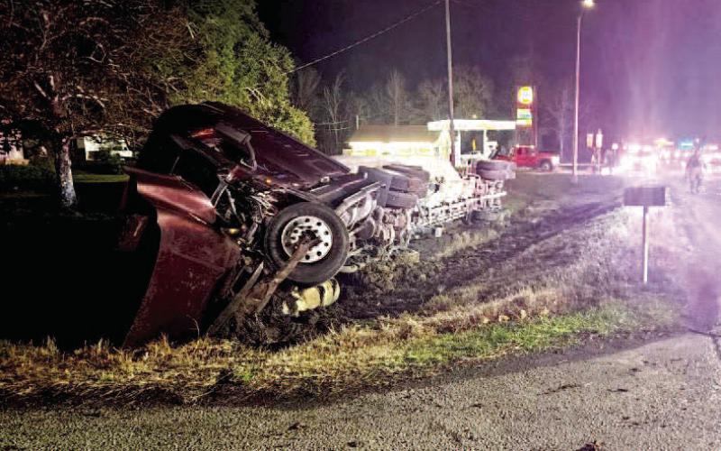 Overturned 18 wheeler shuts down FM 105 temporarily