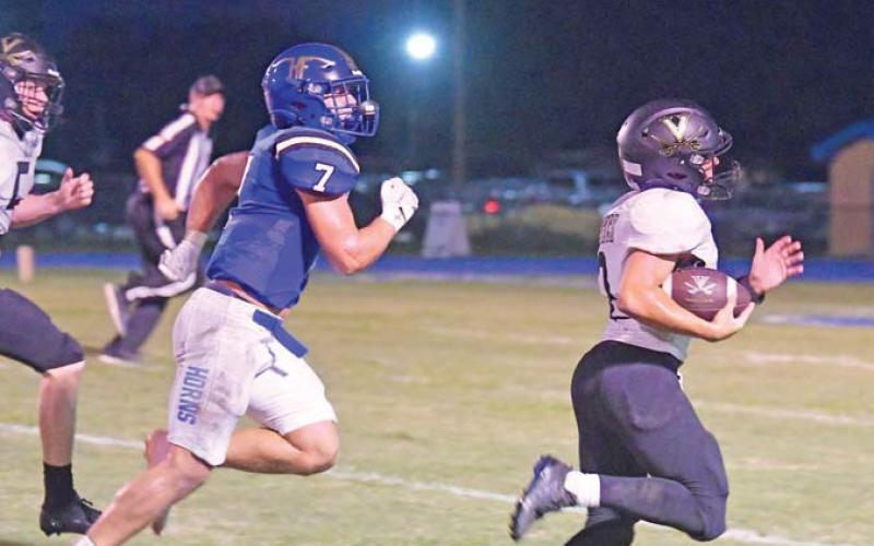 Vidor QB Daigan Venable outran everyone on his way to a 45-yard yard touchdown to get Vidor on the board early in the second quarter at Hamshire Fannett.