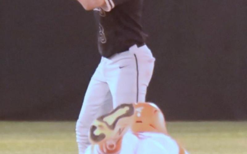 Pirate second baseman Diagan Venable signals to hold the ball as an Orangefield Bobcat runner steals second. Photo by Randall Luker