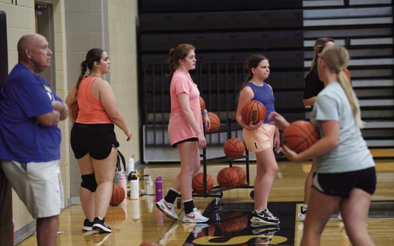 Several Lady Pirates practiced their basketball skills Tuesday morning in the newly waxed Pirate Gym. The ladies practiced their passing and shooting from different positions on the court.