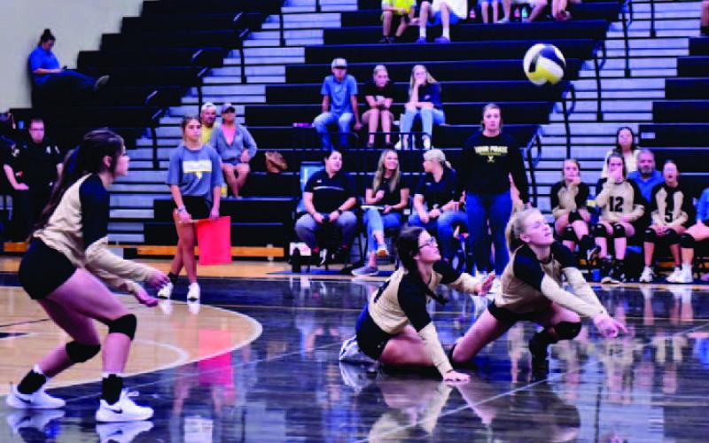Lady Pirate junior varsity players Jaelyn Welch, Audrey Flores and Jaelyn Justice on defense versus the Lady Tors.