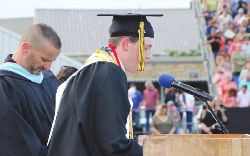Tyler Tarbox led the opening prayer.