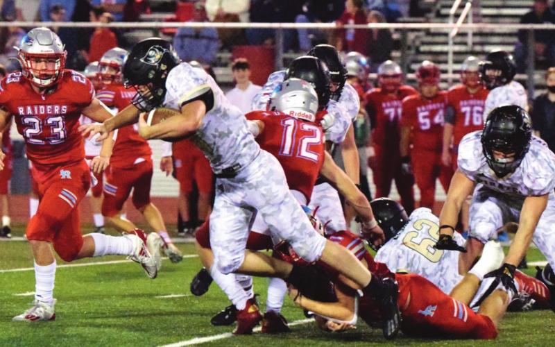 Pirate RB Jason Watson runs outside for a first down against the Lumberton Raiders.
