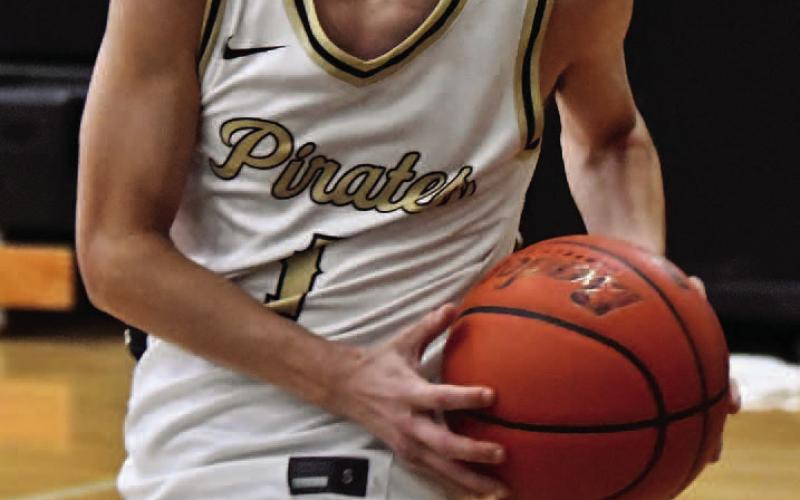 Bryce Loftin, #5, led the Pirates in scoring versus Bridge City with 20 points.
