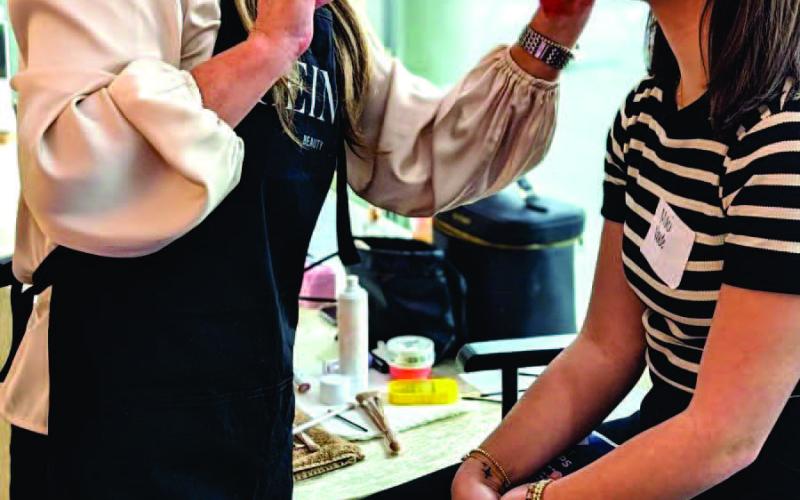 VHS student Maci Verde has her makeup professionally applied as part of the Women In Industry program on how to make the best impression during a job interview.
