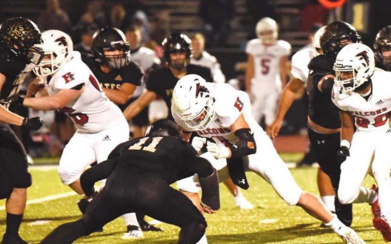 Pirate defenders Colby Smith and Ty Vincent close the front door as Jordan Smith and an unidentified Pirate close in on Falcon RB.