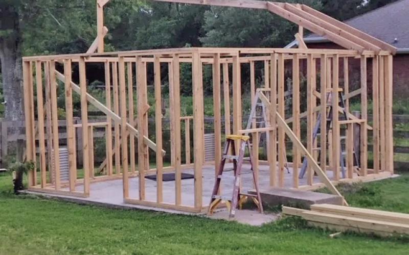 Framing the roof was challenging for us and required a good bit of energy, especially while climbing ladders, holding the lumber into position, manipulating screws and drills to secure the boards into place (image courtesy: John Green).