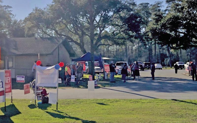Candidates, supporters and voters mingled under the shade of oak trees at the Vidor Community Center as early voting in the Republican and Democrat primary elections kicked off Tuesday. A steady stream of voters took advantage of early voting with 349 in person ballots cast in Vidor. A total of 948 ballots, both by mail (72) and in-person (877) were tallied Tuesday.