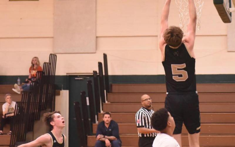 Joe Gardenhire drops one in the basket if Friday’s LCM tournament game versus Shepherd. Photo by Randall Luker