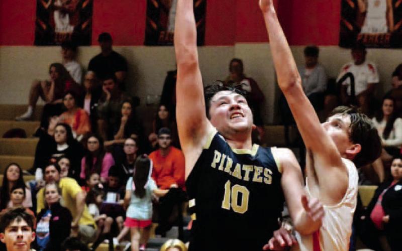 Camden Young shoots past a block in Saturday’s championship game versus tournament host Orangefield. Photo by Randall Luker