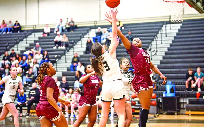 Allie Williams shoots A Silsbee defender swats at the ball as Vidor’s Allie Williams shoots from the paint Friday in Pirate Gym.