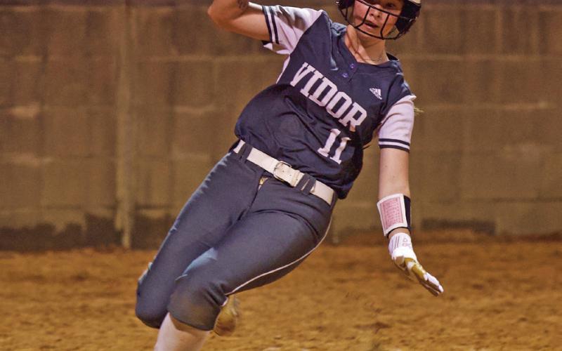 Softball-Eryn Barraza scores in Friday’s game versus Lumberton.