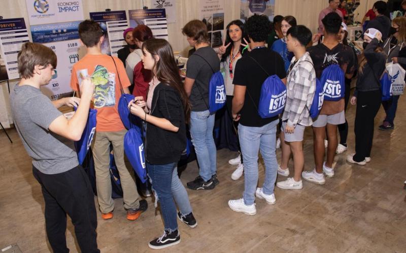 Students gather at the Port of Beaumont booth.