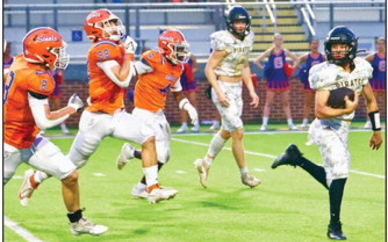 Daigan Venable looks back at his pursuers as he heads for a touchdown Friday versus the St. Louis Saints. Photo by Randall Luker