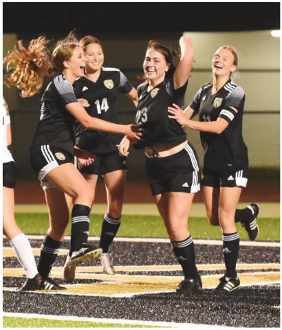 Lady Pirate teammates congratulate Alaina Davis #23 after her goal against Jasper Tuesday.
