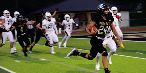 Pirate QB Jarrett Odom heads for the end zone and Vidor lone TD Friday after a Brayden Root interception gave Vidor the ball on the Silsbee 16 yard line. Photos by Randall Luker