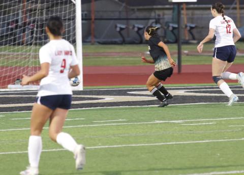 Sneaks the ball into the net