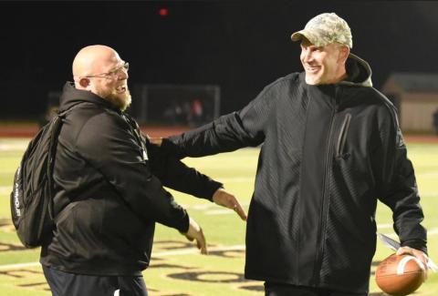 Photo by Randall Luker Vidor Pirate football offensive coordinator Mike Trahan, left, and Vidor Head Football Coach and Athletic Director Jeff Mathews are all smiles after the Vidor Pirates clinched the top spot in district Friday by defeating the Lumberton Raiders 28-27, overcoming a 20 point deficit.