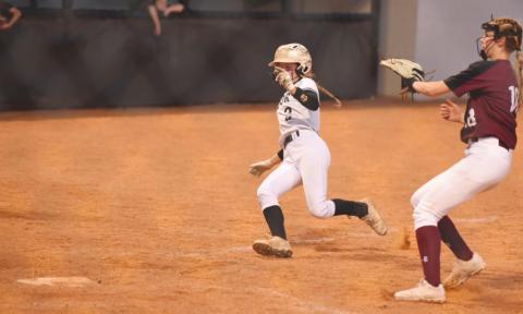 Skyler Head beats the throw at home in Tuesday’s game versus the Silsbee Lady Tigers.