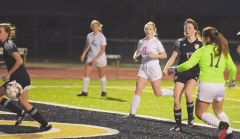 Lady Pirate #17 Amelia Wright watches as her kick heads for score against the BC Lady Cardinals Tuesday.