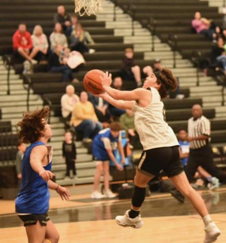 Photo by Randall Luker Blayne Holcom takes a shot versus Kelly Saturday.