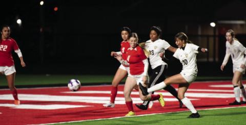 Gracelen Simmons, #10, sends the ball in for a score in the junior varsity match against Bridge City Friday. Photo by Randall Luker
