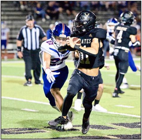 Bryce Dubose eluded numerous Trojan defenders to score on a Pick 6 Friday versus the Trinity Christian Academy Trojans. Photo by Randall Luker