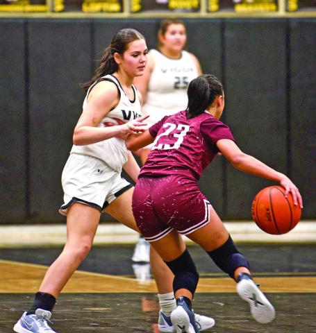 Guarding a Tiger A Silsbee Lady Tiger tries to get past Vidor’s Kinsey Dillard in Fridays’ game at Pirate Gym.