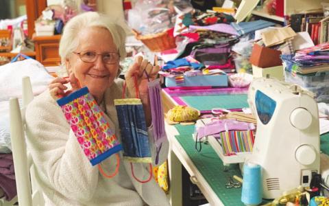 Kay Pressley, a member of the Crafty Ladies Club of the Texas Extension Education Association in Rains County, shows some of the cloth face masks she made as part of Operation Face Mask. Photo courtesy of Texas A&amp;M AgriLife Extension Service