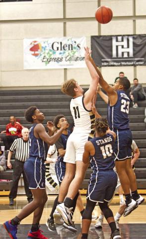 Root Shoots In a Crowd Brayden Root shoots over a Mustang defender Tuesday in Pirate Gym.
