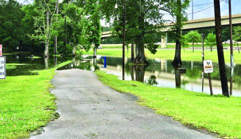 Afternoon and overnight thunderstorms brought damaging winds to portions of Orange County but the Vidor area mostly experienced minor flooding. The Claiborne Park’s walking track is partially underwater in the photo taken Tuesday afternoon. Photo by Randall Luker