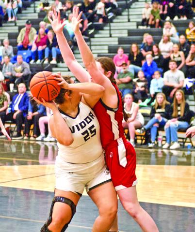 Looking for a shot Laikyn Broadnax looks for her shot as a BC defender leans on her under the net.
