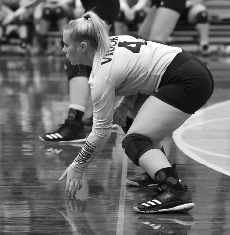 Aarilynne Richardson prepares to receive a serve. Photo by Randall Luker