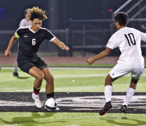 It’s all in the feet Rui Correia maneuvers past an Anahuac defender in Monday’s scrimmage. the Pirates won 7-0.