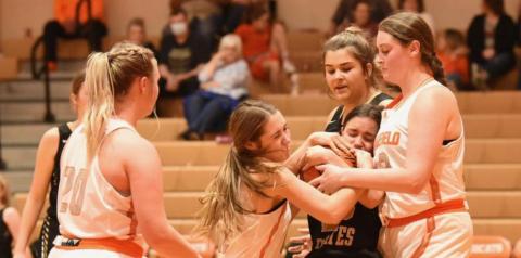 Lady Pirate Sofia Rodriguez is caught between two Lady Bobcats as she fights for control of the ball.