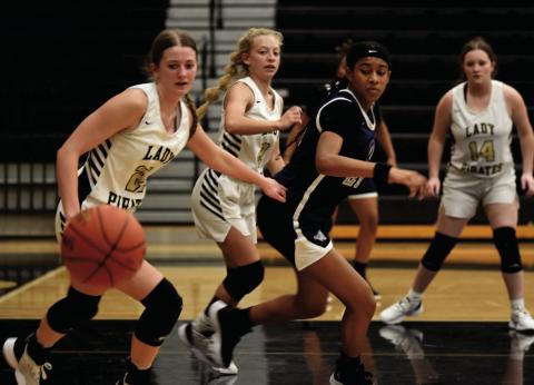 Madison Powell, Mia Robin and Carlie Abbott, left to right, keep an eye on an up for grabs ball lat week’s district matchup with The lady Mustangs of West Orange Stark. Photo by Randall Luker