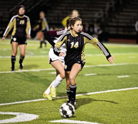 Michaela Droptini dribbles past a Silsbee defender. Photo by Randall Luker