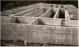 The football field sized AeroMod wastewater treatment unit dominates the Water District's new state-of-the-art wastewater treatment plant under construction at the site of the current operating Oaklane wastewater treatment plant. The multi-chambered, 150-foot by 300-foot reinforced concrete structure has sixteen foot tall walls some of which are sixteen inches wide.