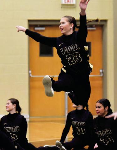 VHS Brigadette Kaitlyn Howard performs with her teammates during halftime of Friday’s varsity basketball game versus LCM. Photo by Randall Luker