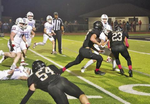 Pirate RB Dane Villadsen heads for the end zone and a touchdown behind the blocking of Jayden Jones, #23.