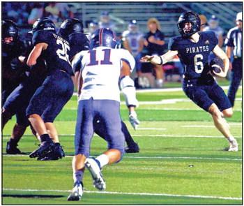 Dane Villadsen cuts back to an open running lane in Friday’s 48-3 blowout win over the TCA Trojans. Photo by Randall Luker