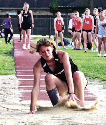 Sand flies as senior Lady Pirate Jaden Lee makes her landing in the Triple Jump event at Thursday’s VHS Invitational Track Meet. Lee took first place in the event with a leap of 35’ 10.75”. Vidor Track and Field athletes will be in competition next in Anahuac at the Gid Campbell Relays March 23.. Photo by Randall Luker