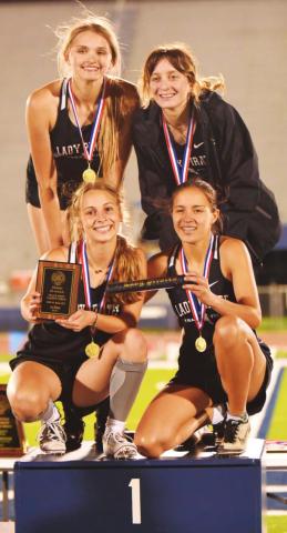 Mile Relay District champs-Lady Pirates Raegan Stephenson, Amelia Wright, Jana Baters and Sofia Rodriguez pose on the podium following their first place finish in the district track meet last week.