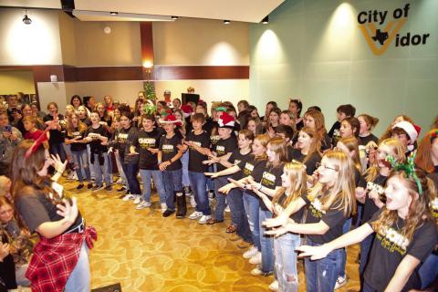 The Vidor Middle School 6th Grade Choir under the direction of Genevieve Brassard entertained a crowd Friday at Vidor City Hall at the Light Up City Hall portion of the 3-day Vidor Hometown Holidays event sponsored by the City of Vidor, Vidor Chamber of Commerce and Eastgate Church.