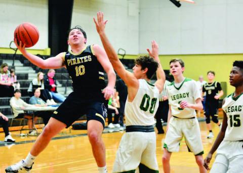 Camden Young scores in the Legacy game Saturday in Nederland.