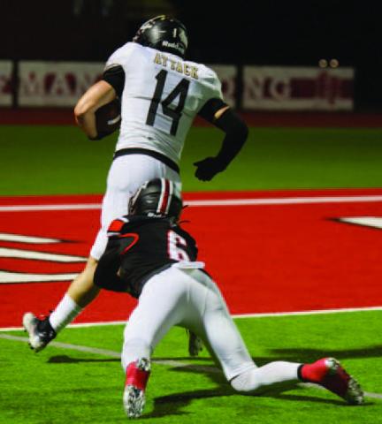Pirate running back Jason Watson, #14, scores his first of six rushing touchdowns against Huffman Friday. The Huffman player is Tyler Wilkins, who scored five catches for touchdowns for the Falcons. Photos by Randall Luker