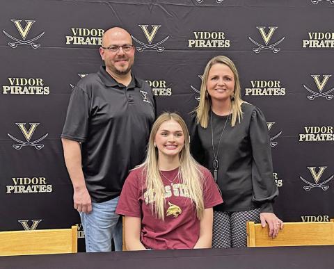 Lady Pirate high jumper Raegan Stephenson officially committed to Texas State in San Marcos last week. As a Freshman, Stephenson won a silver medal in the 4A girls high jump at the state meet and last year, she won the gold medal with a jump of 5 feet, seven inches. Stephenson is pictured with her coaches Darin Fletcher and Tracy Maines.